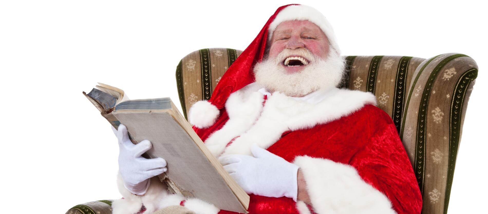 Santa reading in chair 