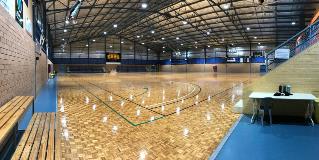 Entrance view of indoor courts 5 and 6 at Ray Owen Sports Centre with upgraded LED lighting
