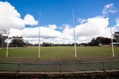 Football field View from behind the football goal posts at Kostera Oval