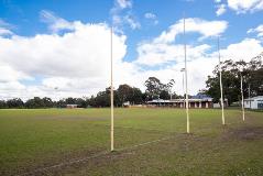 View of the football posts with club houses in background at Kostera Oval