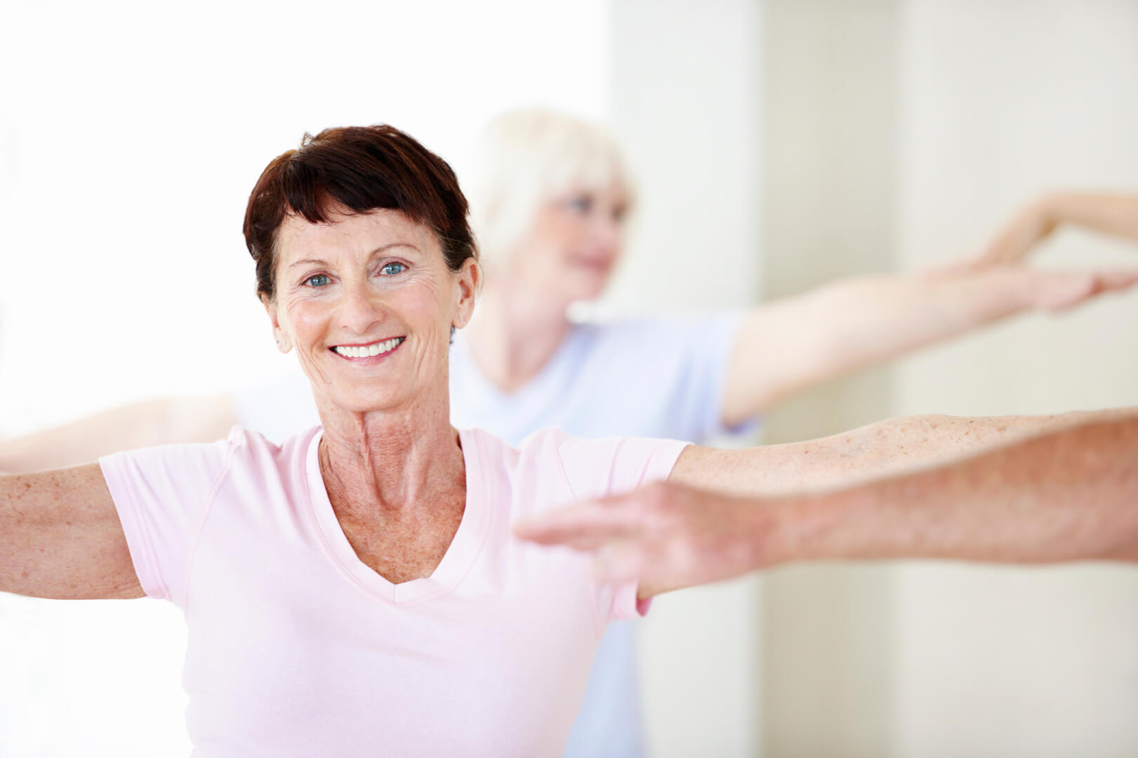 Active Seniors program - a senior lady yoga arms out