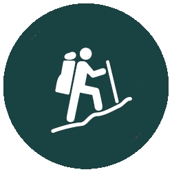 Grade 5 Walking Trail symbol - person walking up on an incline with a backpack and walking pole